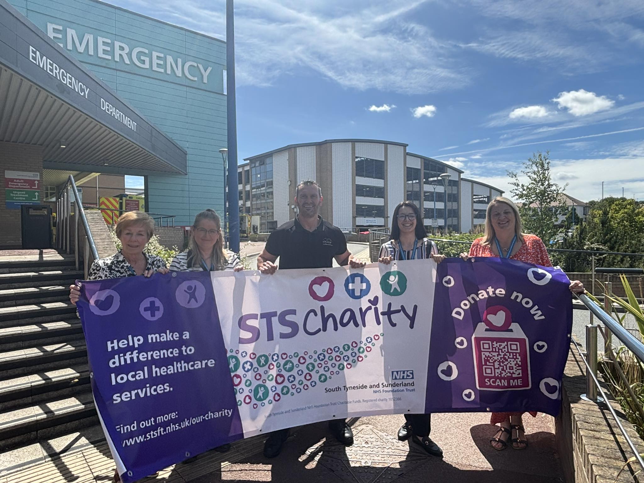 Mark Hardy with staff and volunteers from the Cancer support service.jpg