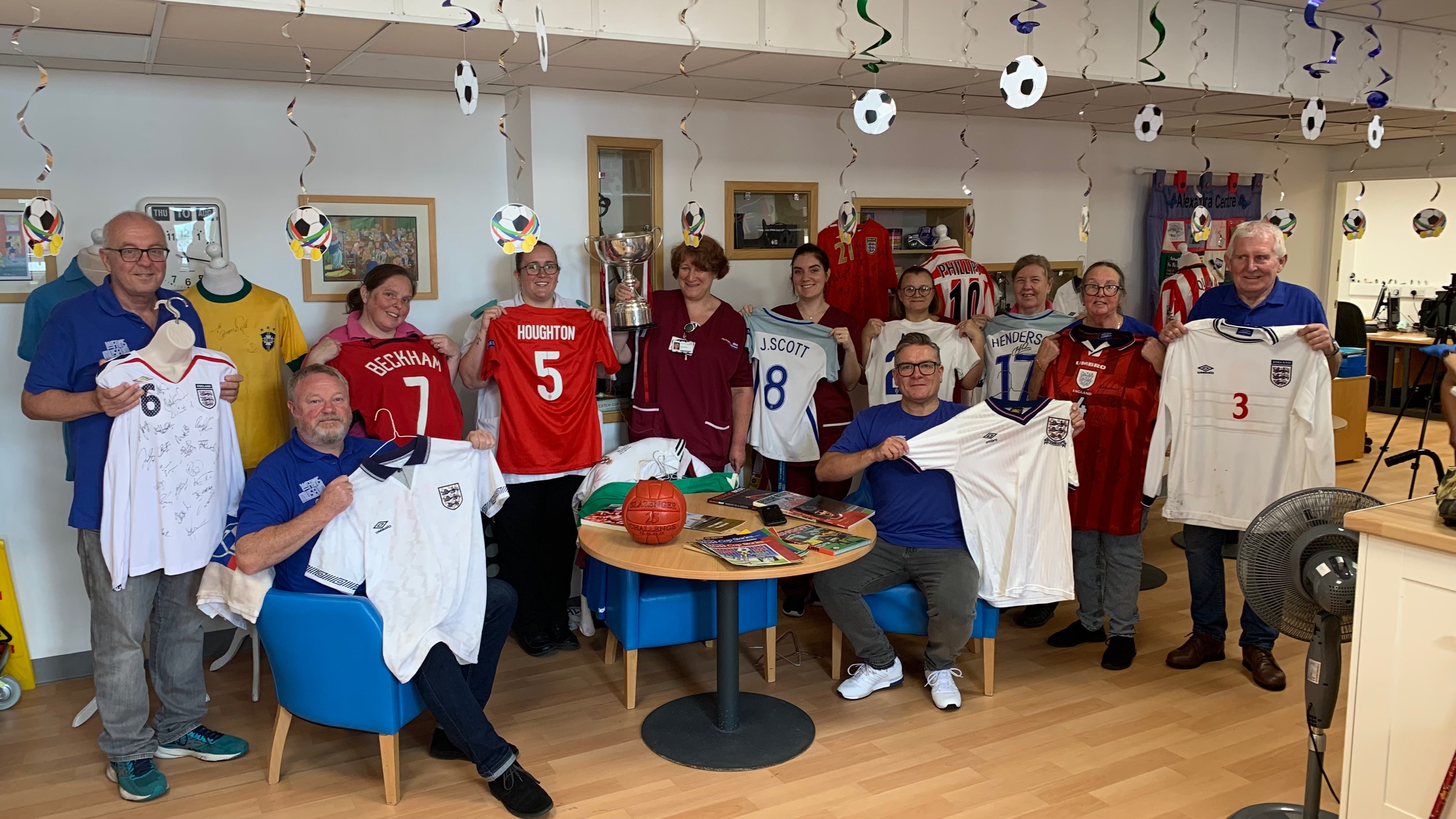 Fans Museum volunteers and DDOT team members with memorabilia on show during the visit to the Alexandra Centre..jpg