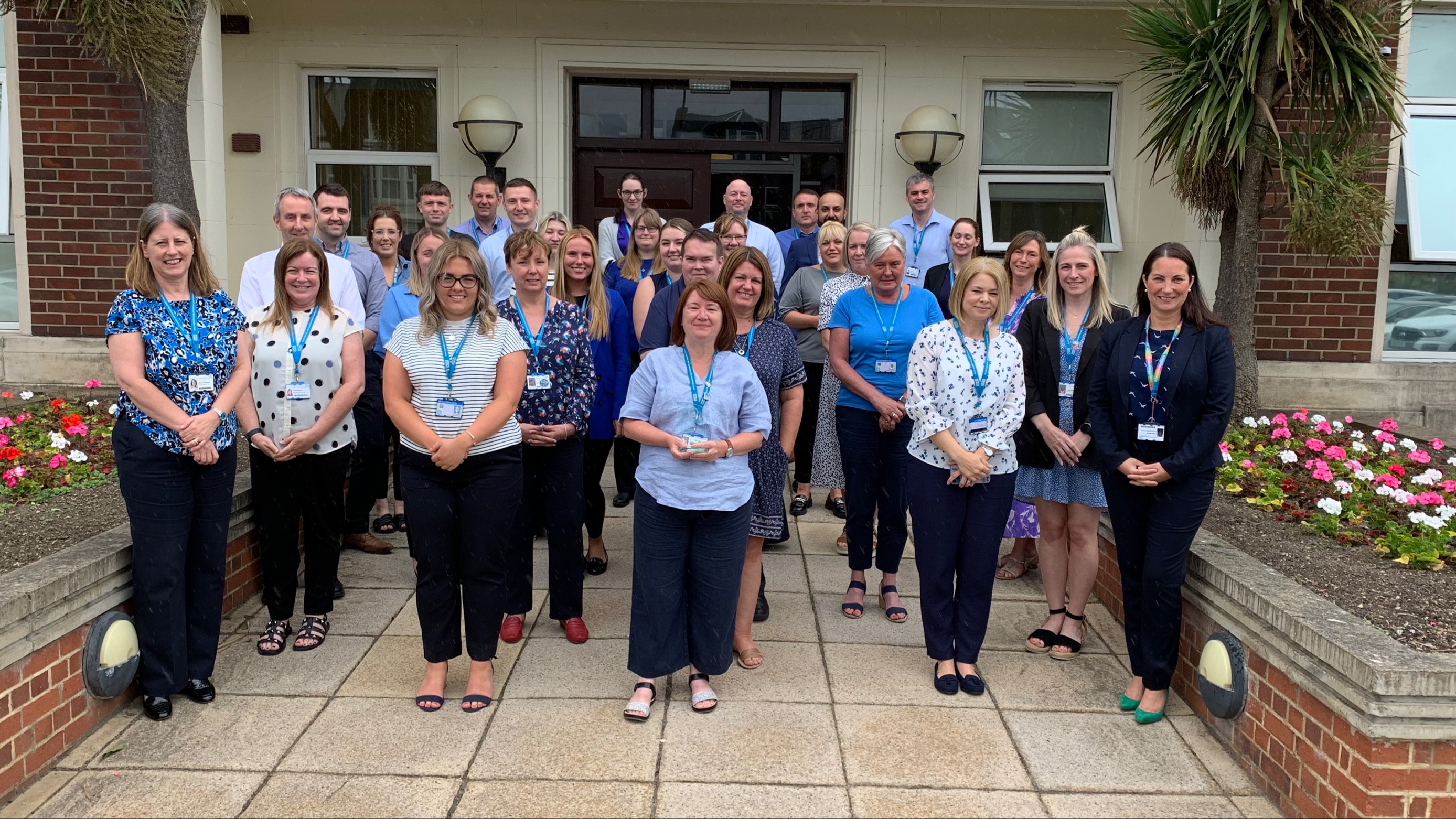 The South Tyneside and Sunderland NHS Foundation Trust Director of Finance Hayley Wardle, front right, with her team and their award..jpg