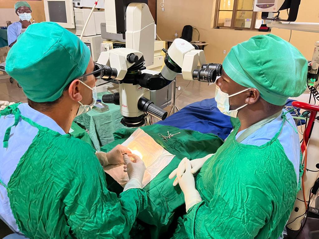 Mr Karim El-Assal, left, operates on a patient..jpg