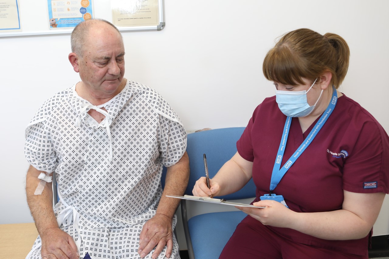 Patient Bob Dove goes through his pre-MRI scan check with MRI Radiographer Claire Watson..jpg