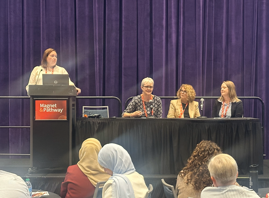 A panel of experts on a stage at the Pathway to Excellence conference