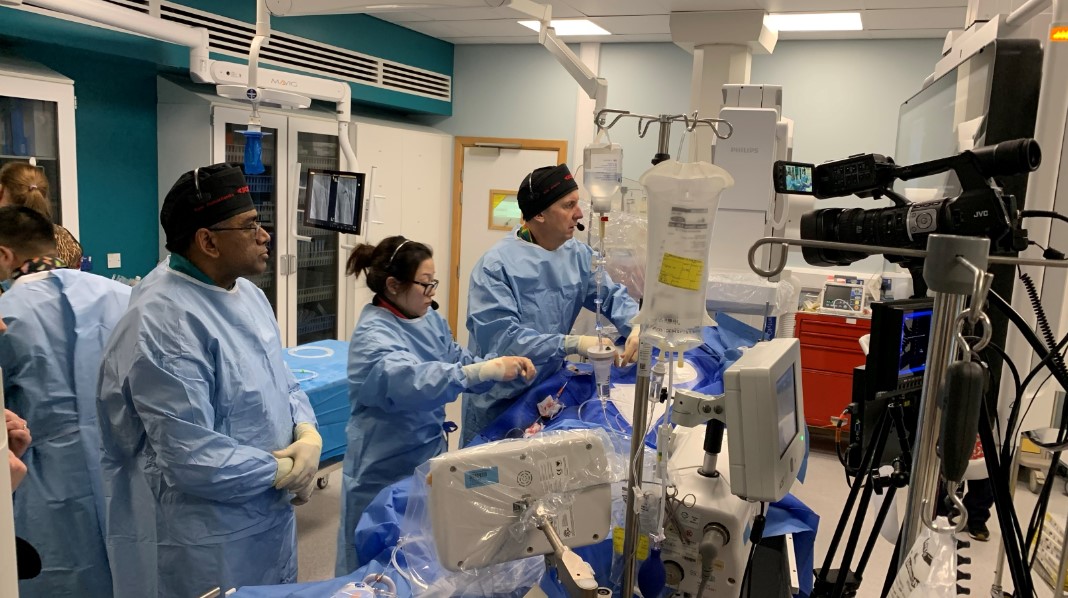 Dr Nick Jenkins, right, and colleagues treating one of the patients as it was filmed for the conference..jpg